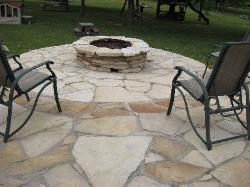buff sandstone flagstone patio and firepit