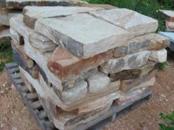 A finished pallet is topped with a few extra stones and is ready for a customer.