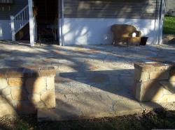 flagstone stepper patio - thin veneer over concrete - wall with brick trim 