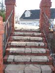 natural stone step with red brick trim