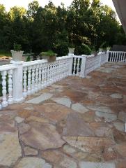 white balcony railing and natural stone patio in columbia, MO
